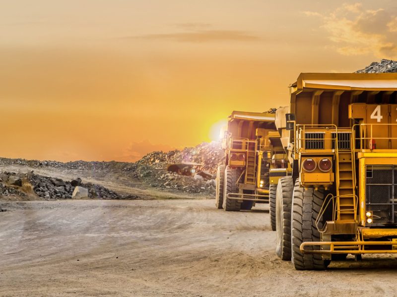Dump Trucks transporting Platinum ore for processing