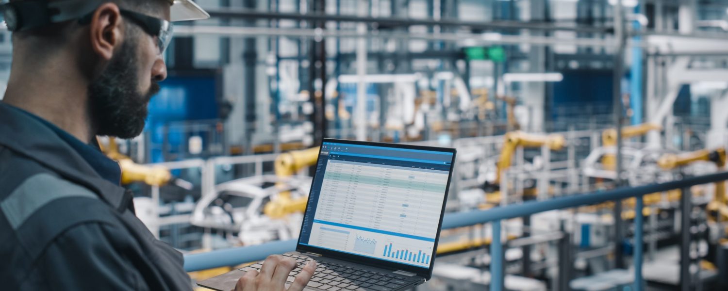 Car,Factory,Engineer,In,Work,Uniform,Using,Laptop,Computer,With